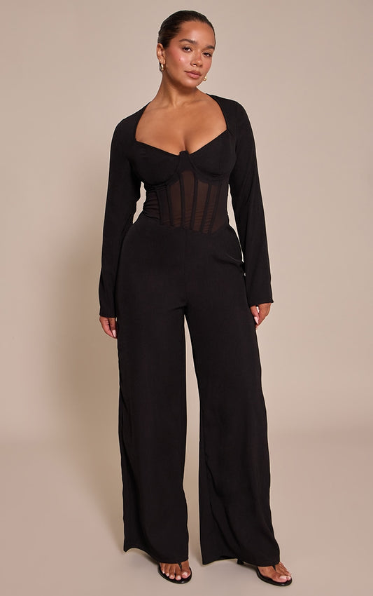 https://cdn-img.prettylittlething.com/0/5/d/b/05dbf690f9bea4fed573005b9c9f1a68832e7441_CNO4684_1_shape_black_tailored_woven_corset_jumpsuit.jpg